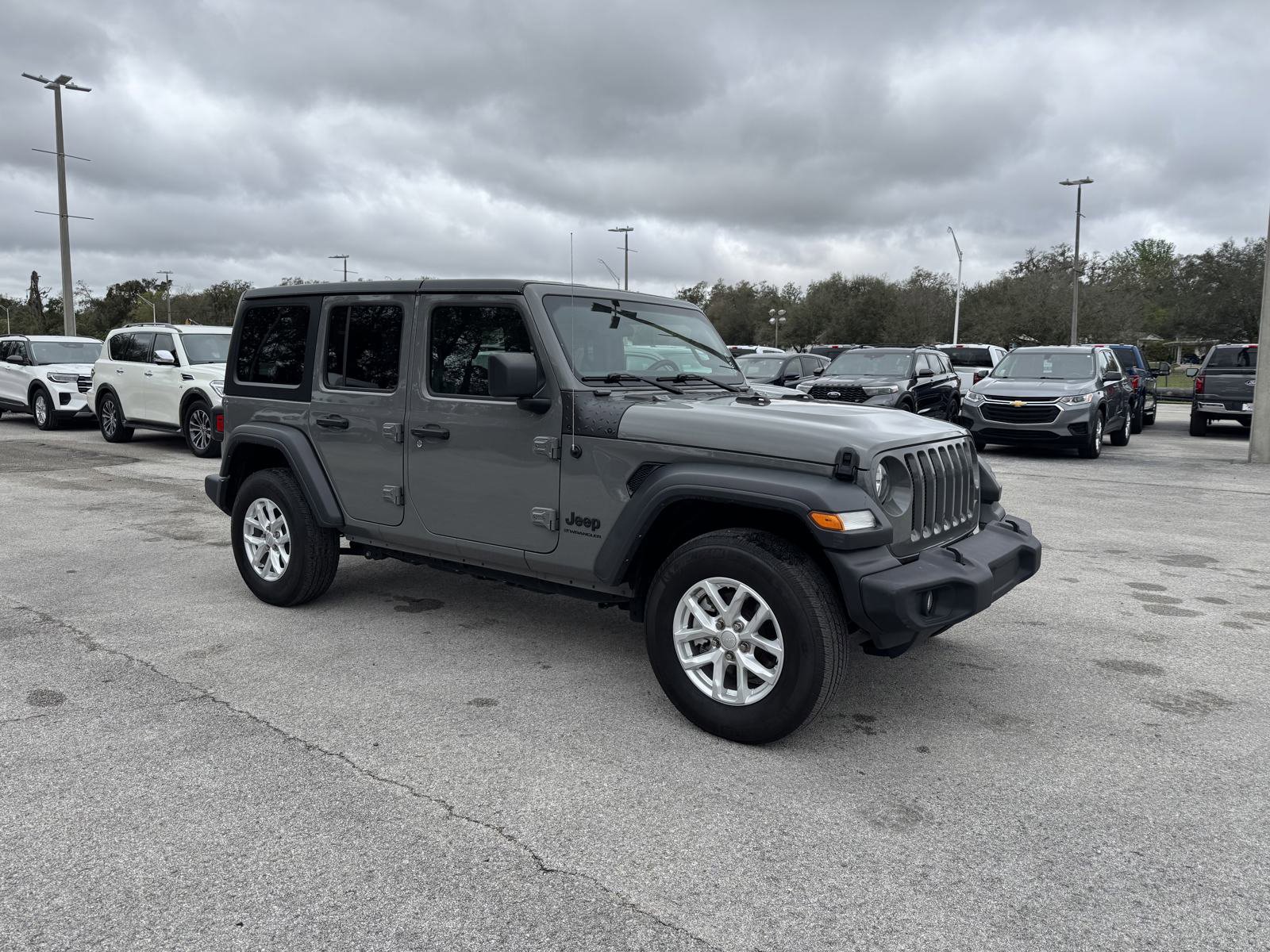 Used 2023 Jeep Wrangler 4-Door Sport S with VIN 1C4HJXDN9PW698016 for sale in Dade City, FL
